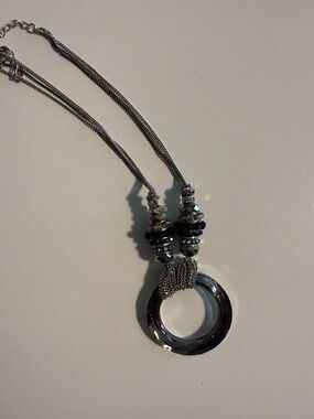 Silver Multi-Chain Costume Necklace with Round Pendant and Black Bead Accents